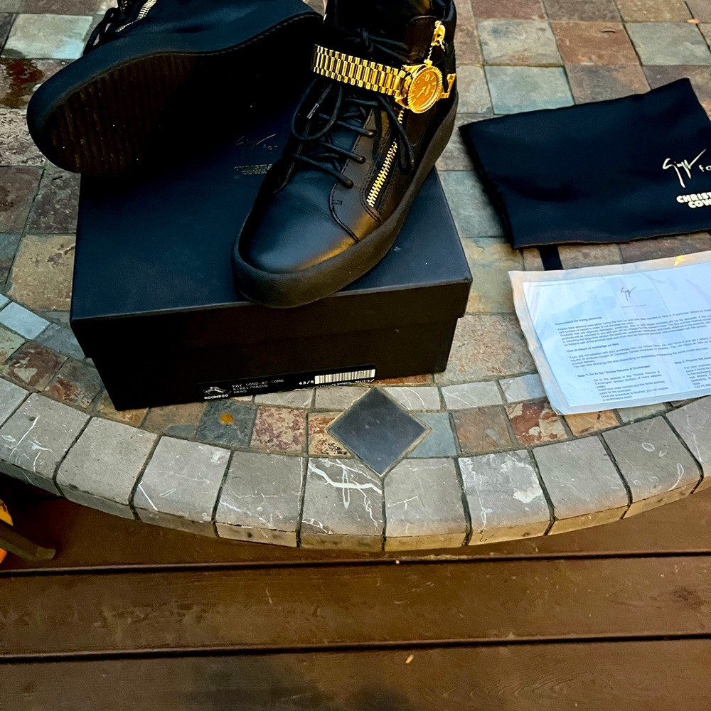 Used Giuseppe Zanotti sneakers. Black w/ gold Velcro watch strap. Size 11 (US)